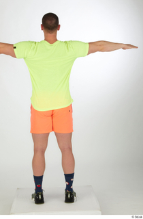 Joel dressed green sneakers orange shorts sports standing t-pose whole…